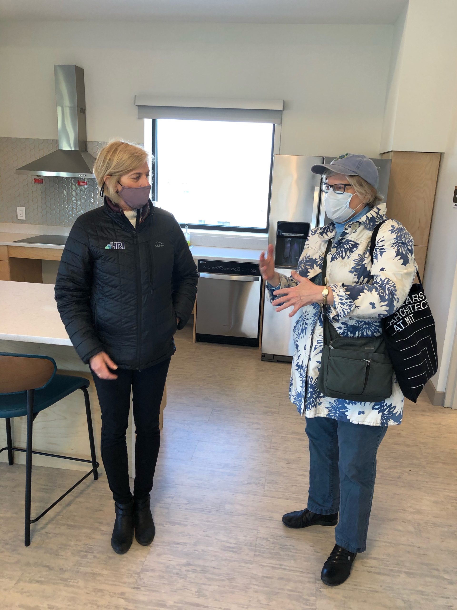 Jane and Kim chat in the community room